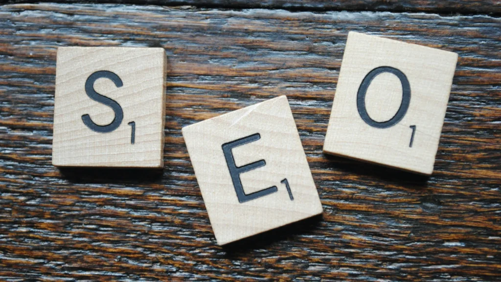 Scrabble tiles spelling out SEO, symbolizing how SEO can improve window cleaning services' online visibility.