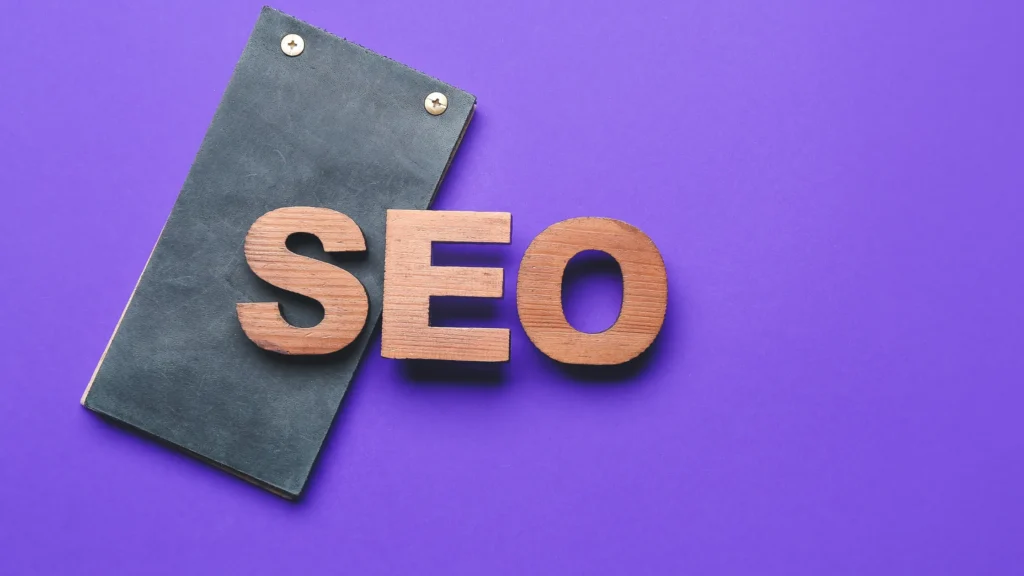 Wooden letters forming "SEO" on a purple background symbolizing Local SEO for Churches.