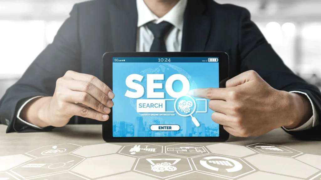 Businessperson holding a tablet displaying SEO search, highlighting SEO strategies for Muslim brands in the market.